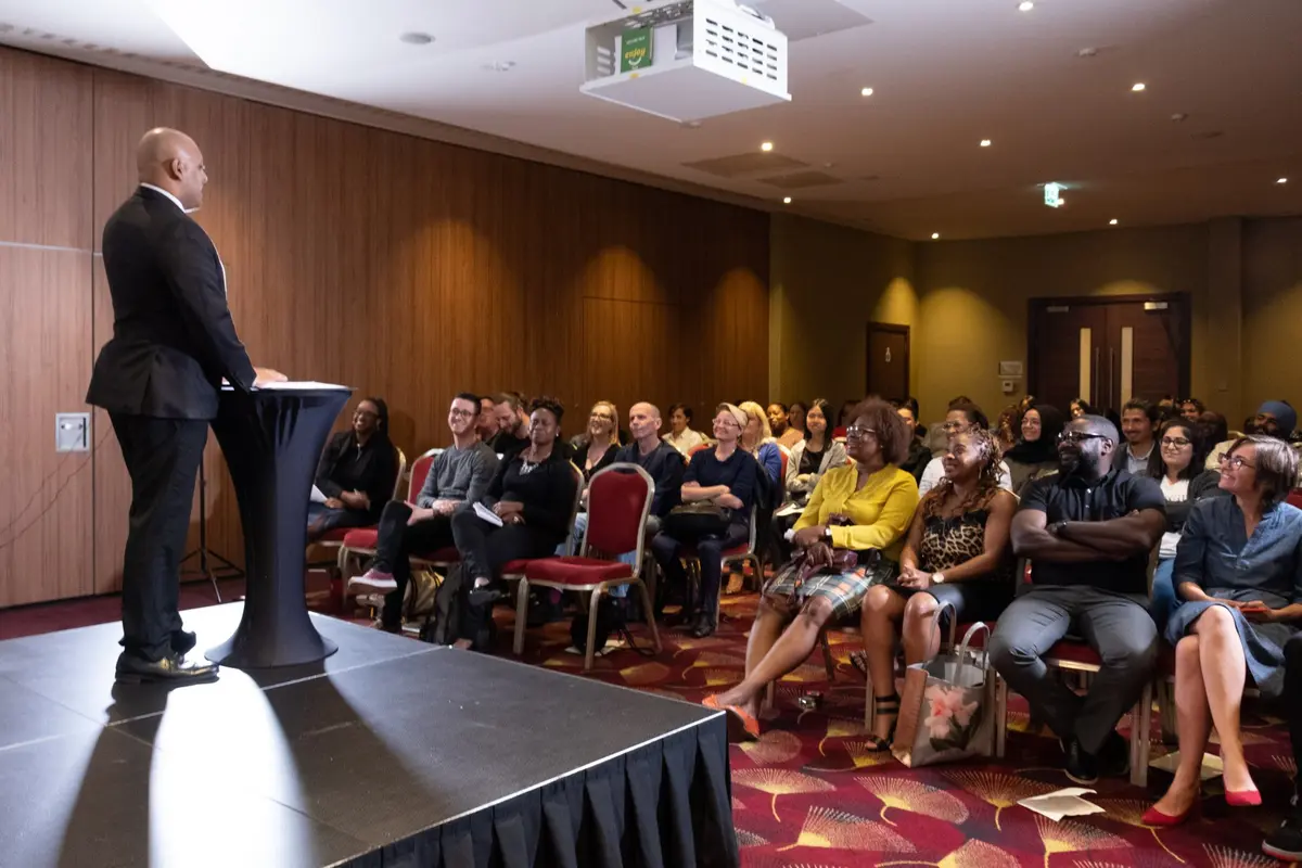 Darren Starr speaking on stage